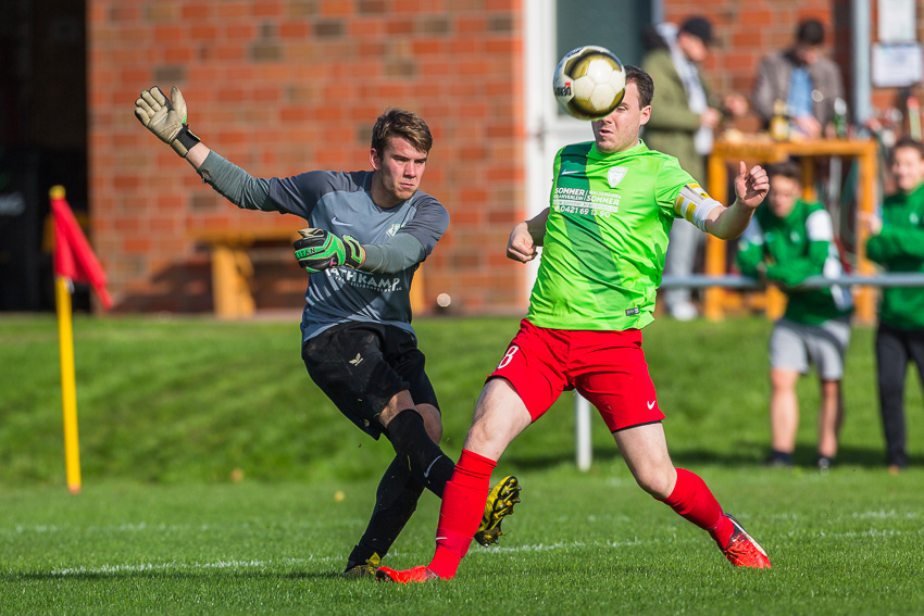 Two soccer players in a duel