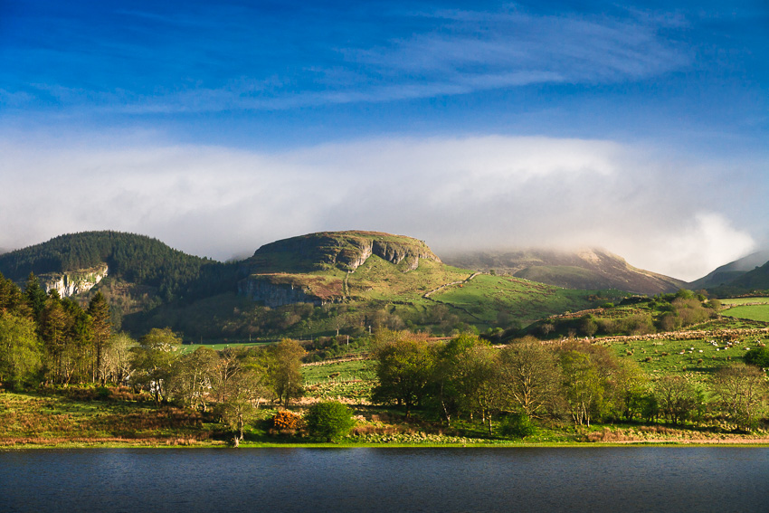 Irish Landscape Landscape photo with green hills and mountains, lake and blue sky in Ireland