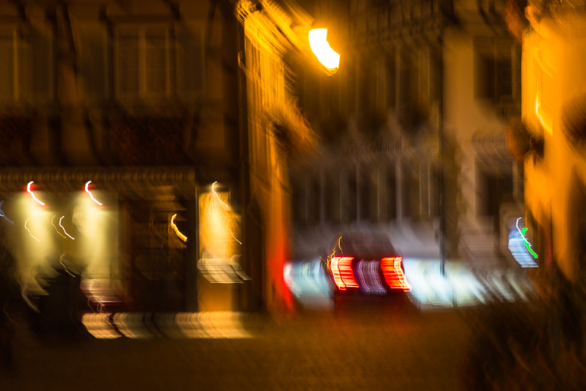 Blurred car Blurred photo of a car driving through an alley at night